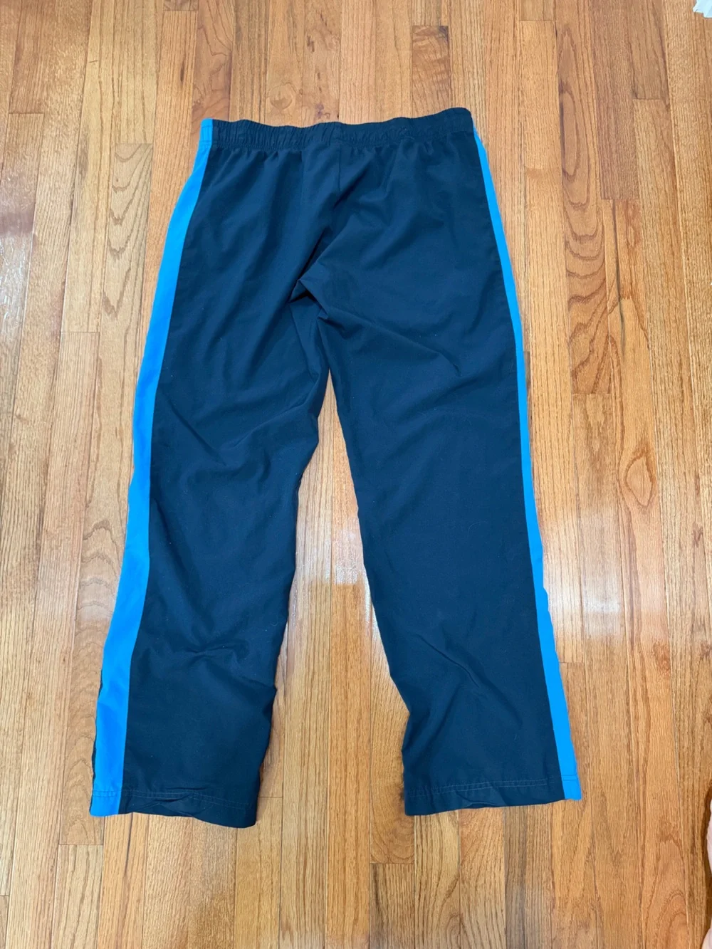 Nike Black Track Pants with Blue Side Stripes